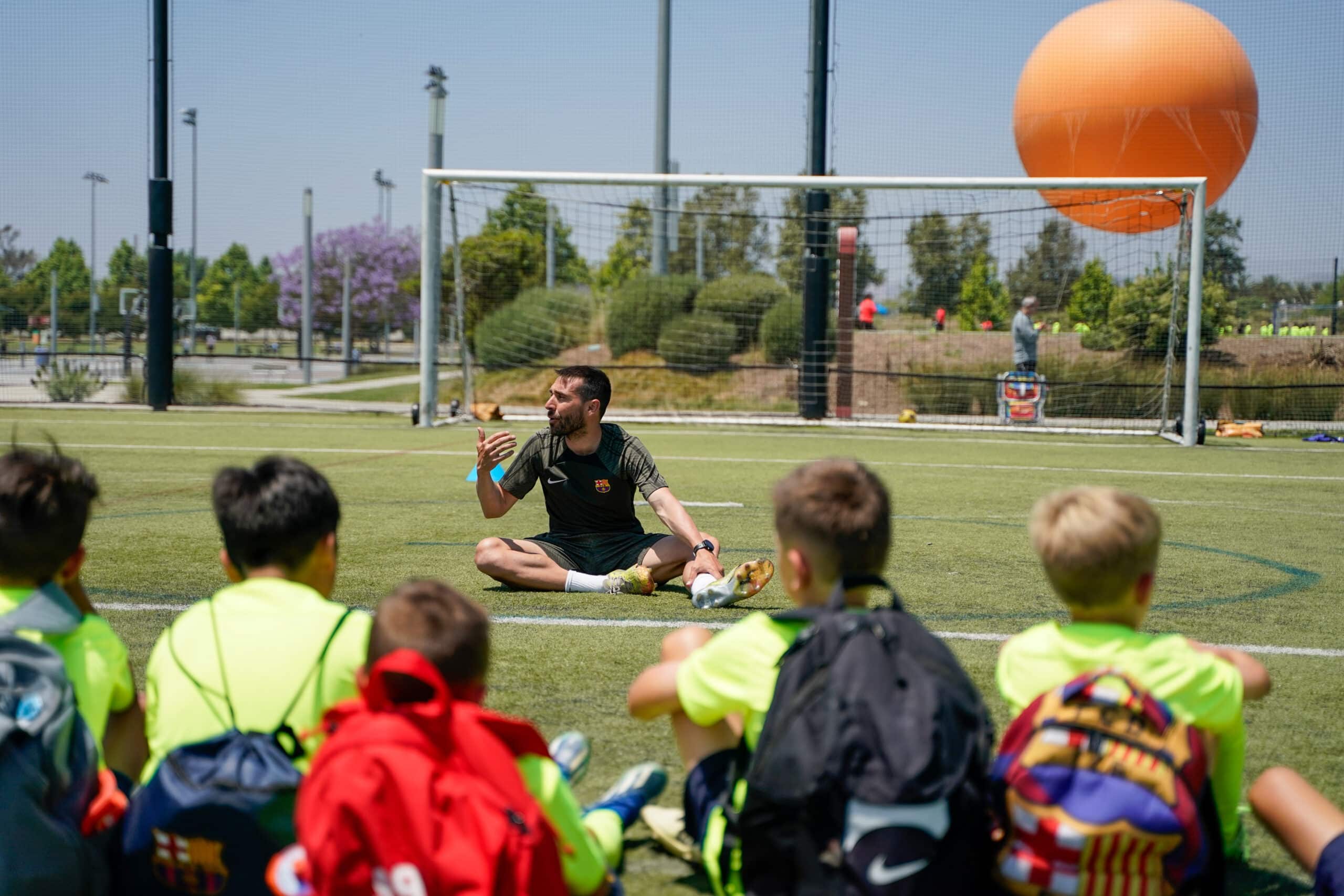 Coach stretching in a soccer field