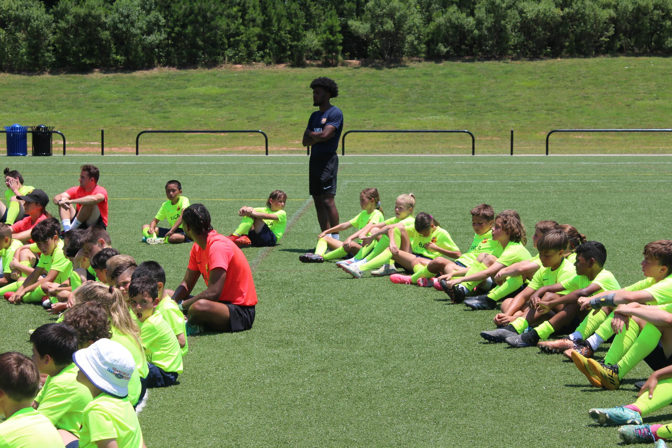Kids stretching in a soccer field