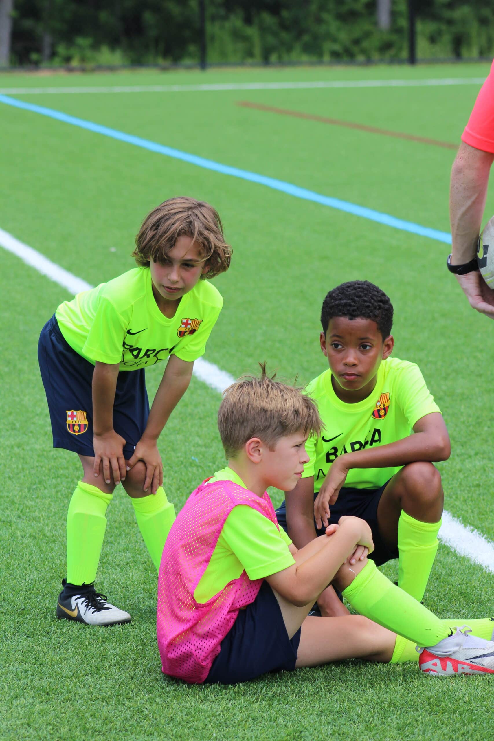 How to recover after a soccer game: kids stretching after a game